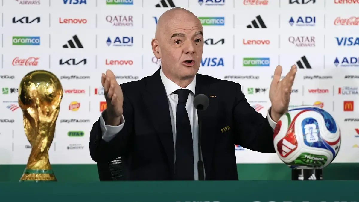 FIFA-President-Gianni-Infantino-speaks-during-a-press-conference-in-Mexico-City-on-June-10-2026-the-eve-of-the-World-Cup-opener-between-Mexico-and-South-Africa-The-winners-trophy-is-placed-in-front-of-him